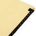 A yellow file folder with black Avery 11350 Pre-Printed Leather A-Z Dividers.