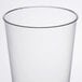 A close-up of a Fineline clear plastic tumbler with a thin rim.