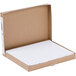 A cardboard box with white paper inside.