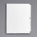 A white file folder with Avery Premium Collated Table of Contents Dividers with black text.