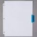 A white sheet of paper with a blue rectangular object with a white border on it.