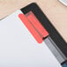 A file folder with Avery Extra Wide 5-Tab Dividers with red tabs.