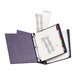 A purple binder with Avery Extra Wide Multi-Color Tab Dividers and a few papers.