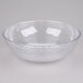 A clear Camwear round ribbed bowl on a white surface.