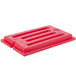 A red plastic Cambro Versa Well cover with four holes.