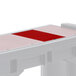 A red and white rectangular cover for a Versa Well.
