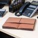 A redrope Universal extra wide expansion wallet on a table.
