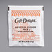 A white Cafe Delight packet of spiced apple cider mix with orange and white text.