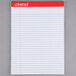 A Universal white legal ruled notepad with red trim.