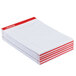 A stack of Universal legal ruled white writing pads with red lines.