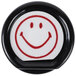 A white button with a red smiley face.