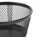 A close-up of a black mesh Universal jumbo storage dish with a handle.