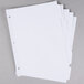 A stack of white Universal 5-tab dividers.