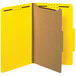 A close-up of a yellow Universal legal size classification folder with brown edges.