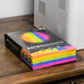 A box of Astrobrights cardstock paper in various colors.