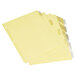 A close-up of Universal clear folder dividers with yellow tabs.