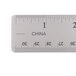 A close-up of a Universal stainless steel ruler with cork back.