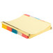 A stack of yellow file folders with colorful tabs.