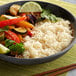 A bowl of Royal Jasmine white rice and vegetables.