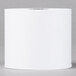 A Universal Office white paper roll on a gray surface.