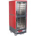 A red and silver Metro C5 heated holding cabinet with clear Dutch doors.