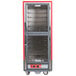 A red metal Metro C5 heated holding cabinet with clear Dutch doors.