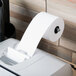 A Universal Office white paper roll on a dispenser.
