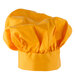 A close-up of a yellow fabric chef's hat with wrinkle
