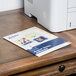 A pack of Avery Printable Magnet Sheets on a table with printed paper on top of it.