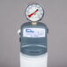 A white and gray Manitowoc Arctic Pure water filtration system with a pressure gauge on top.