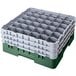 A stack of green plastic Cambro glass racks with six compartments.