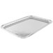 A Vollrath stainless steel rectangular fluted tray.