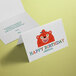 A white Avery half-fold greeting card with a cartoon bear holding a birthday sign.