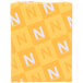 A pack of yellow Astrobrights cardstock with white letters on it.