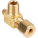 A close-up of a brass Avantco pilot valve with a gold nut.