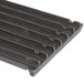 A close-up of an Avantco 6" cast iron grate with rows of holes.