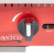 An Avantco red and black control dial on a red and silver box.