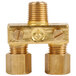 A close-up of a gold Avantco dual pilot valve with brass connectors and two nuts.