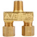 A close-up of a gold metal Avantco dual pilot valve with a brass threaded connector.