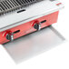 A red and white Avantco gas grill with a grease tray on the counter.