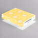 A yellow box with white letters reading "Neenah Exact Index White Cardstock"