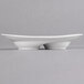 A white porcelain oval divided dish with two wells and handles.