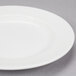 A white Reserve by Libbey porcelain plate with a wide rim.