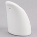 A white porcelain pepper shaker with a small hole.