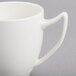 A close-up of a white Reserve by Libbey Royal Rideau coffee mug with a handle.
