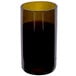 An Arcoroc amber wine tumbler filled with brown liquid.