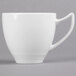 A close-up of a white Reserve by Libbey Royal Rideau porcelain cup with a handle.