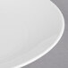 A close-up of a Libbey white porcelain coupe plate with a thin rim.