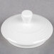 A white round Royal Rideau Tea Pot lid with a small knob on top.