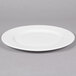 A white Reserve by Libbey Royal Rideau porcelain plate with a wide rim.
